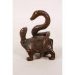 An Oriental bronze of a tortoise with a snake, 2½" high