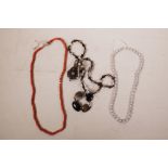 A banded agate necklace and similar bracelet, together with a string of coral beads and a string