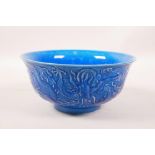 A Chinese blue glazed porcelain rice bowl with underglaze dragon decoration, 6 character mark to
