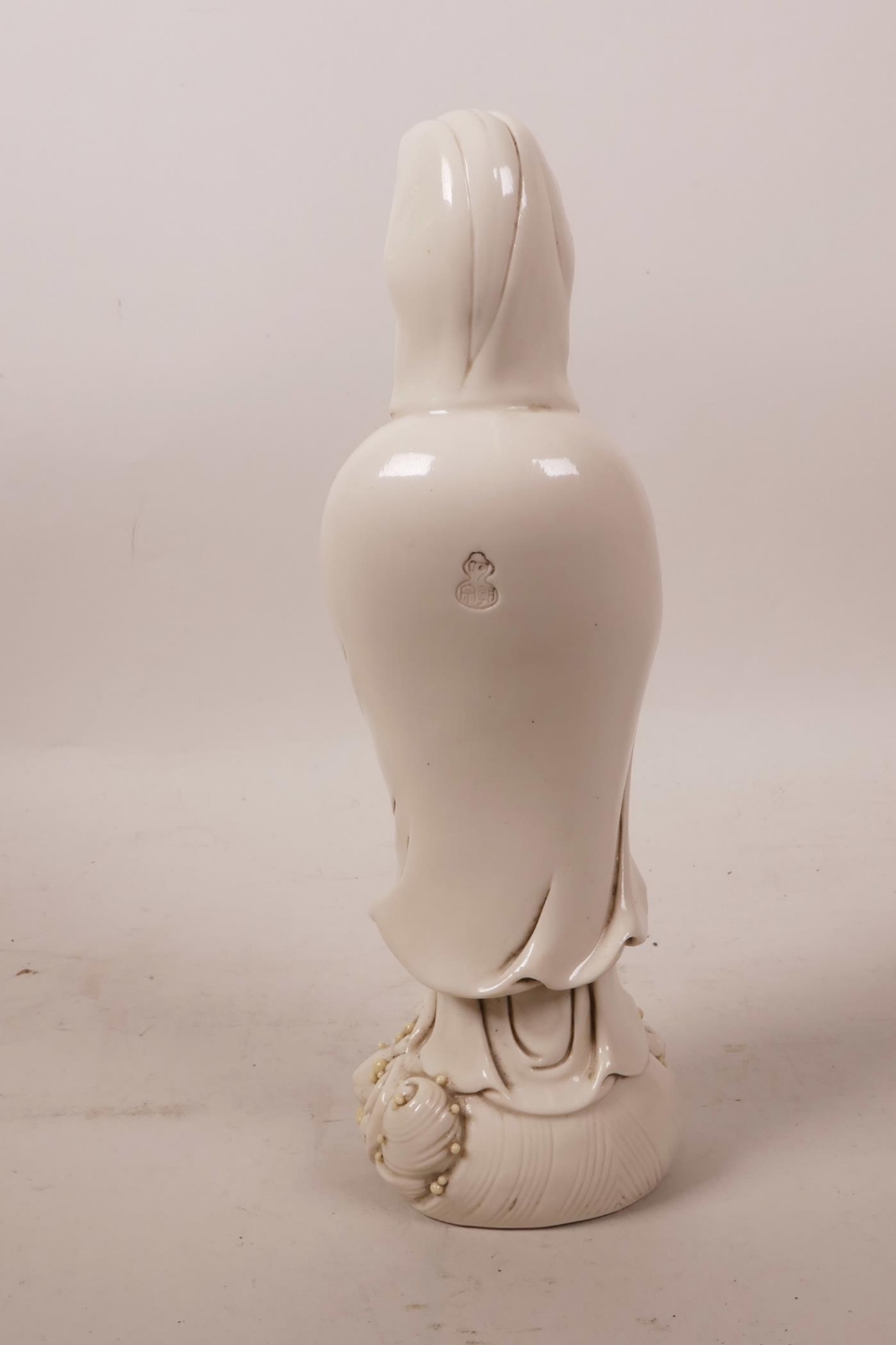 A Chinese blanc de chine figure of Quan Yin, impressed mark verso, 9½" high - Image 2 of 3