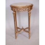 A Louis XV style giltwood occasional table with carved pierced frieze, fluted supports, pierced