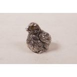 A novelty sterling silver chick with glass set eyes, 1"