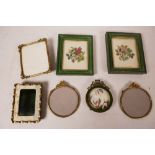 A enamelled miniature photo frame with ribbon decoration, 2" diameter aperture, together with four