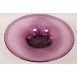 An amethyst glass shallow bowl with rolled rim, 12" diameter