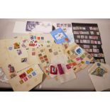 A quantity of world postage stamps including album sheets, specimens, first day covers etc