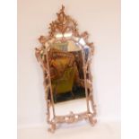 A C19th French silver leafed giltwood sectional wall mirror with carved crest, 68" x 32"