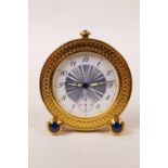 A limited edition gilt metal travel alarm clock by Garrard of London, with sapphire cabochons to