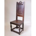 A C17th/C18th oak high back Wainscot chair with fielded panel back, 44½" high