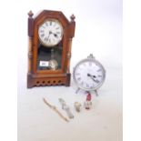 Four lady's wristwatches, a battery operated mantel clock, 6" high, and an early C20th walnut
