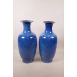 A pair of Chinese mottled blue ground pottery vases, impressed seal marks to base, 13½" high