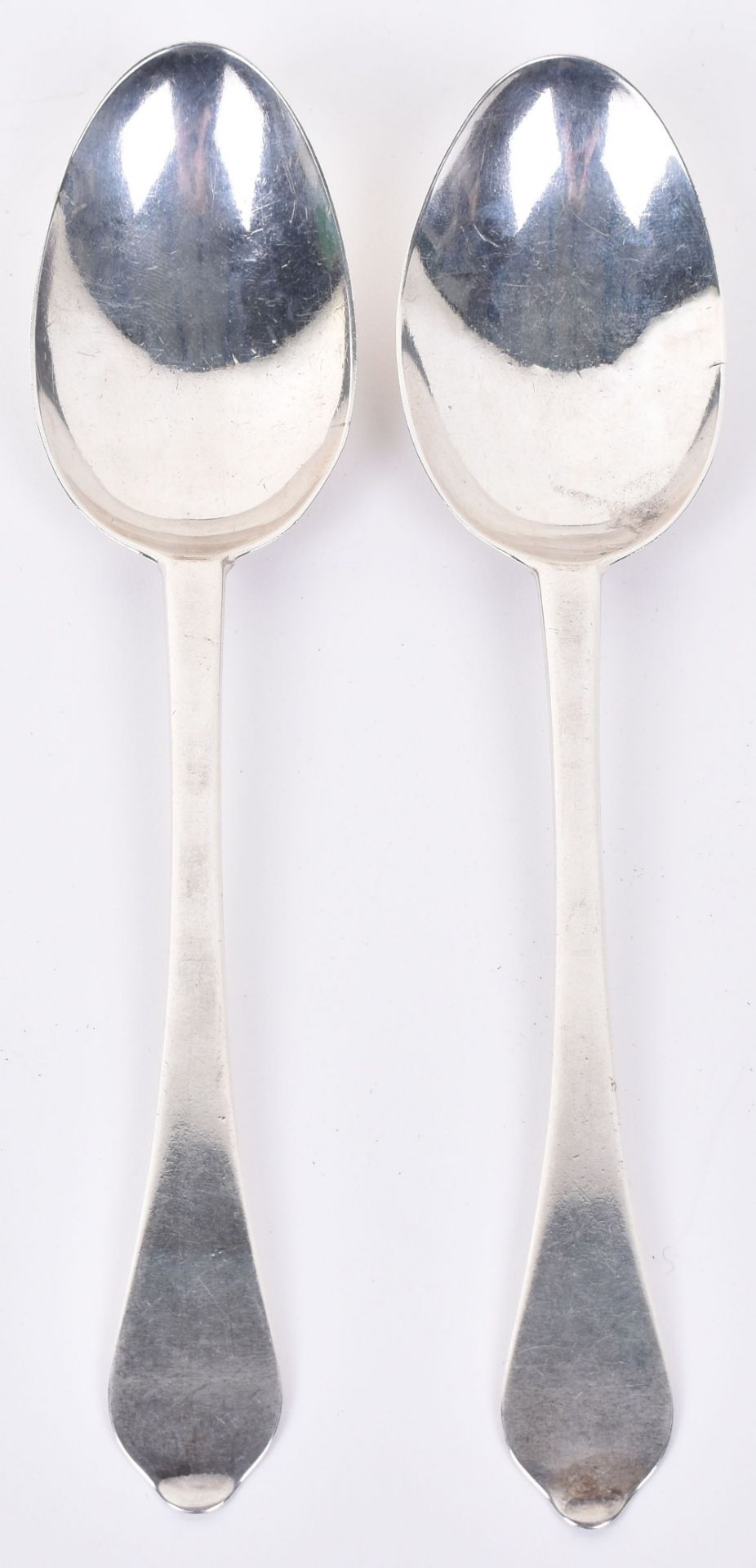 A pair of Queen Anne silver dognose pattern table spoons, London 1700