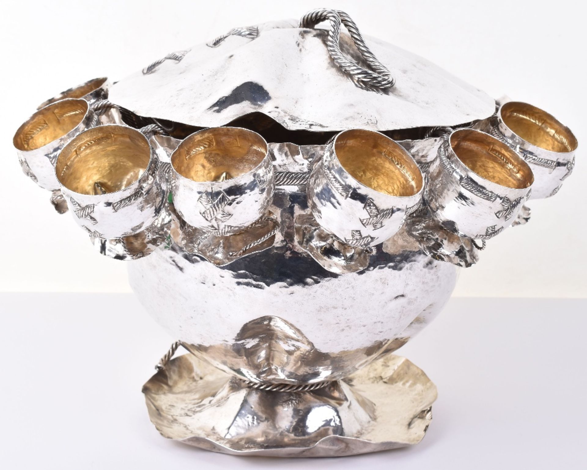 An impressive 20th century German silver (.800) novelty punch bowl and lid with twelve matching silv