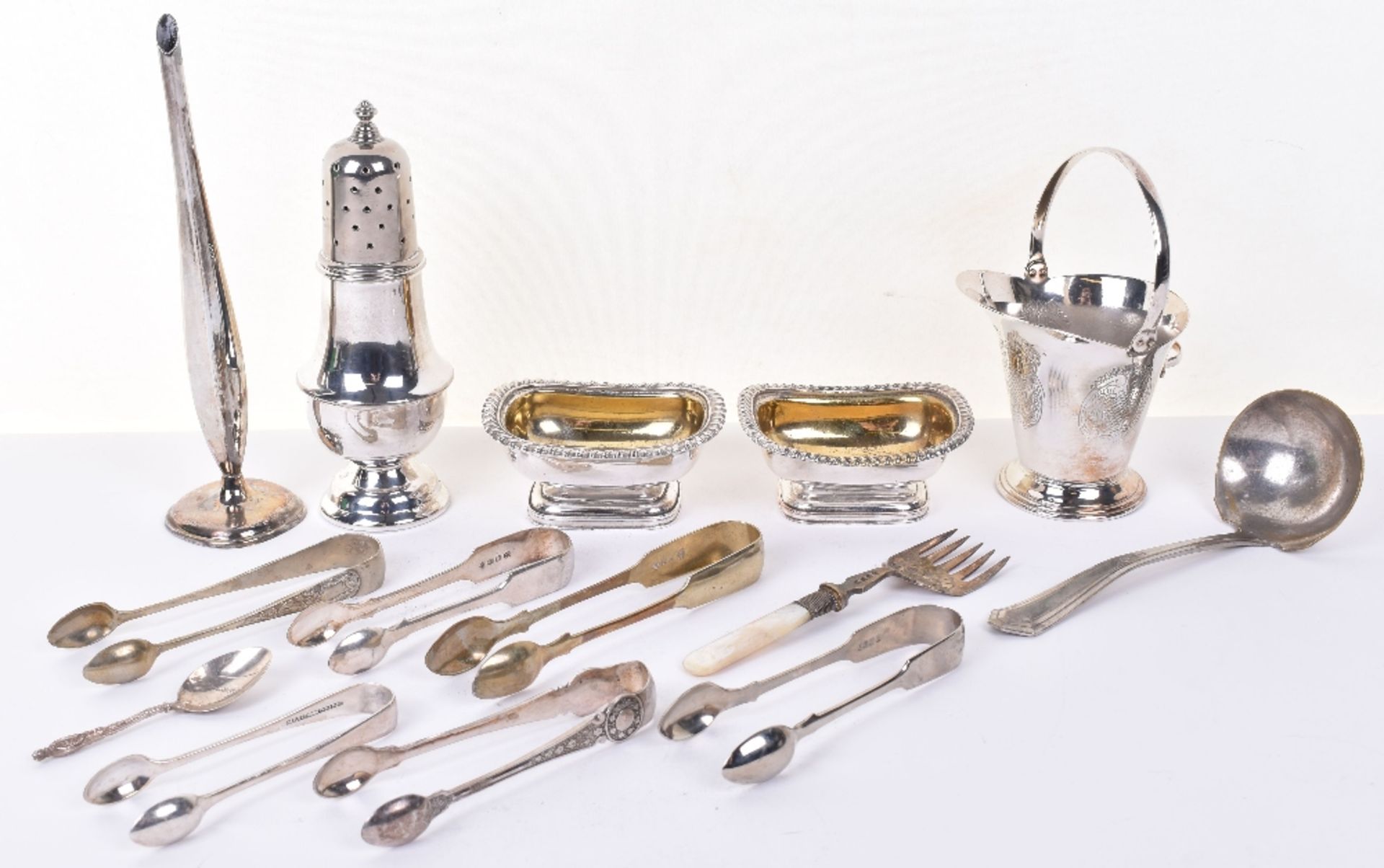 A mixed lot of silver plated items including castor, basket, vase, with some flatware, and pair of s