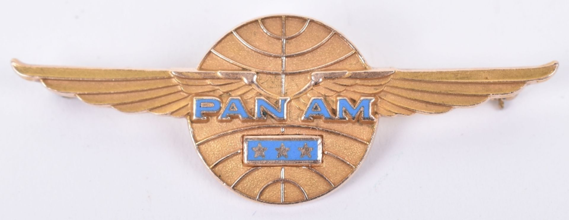 A Pan American Airlines gold brooch, in 10 carat, the back stamped NGB10KNSF, 6cm