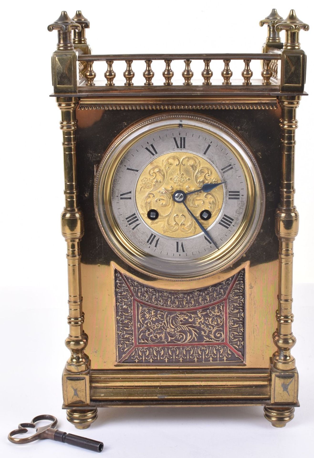 A late 19th century brass mantle clock