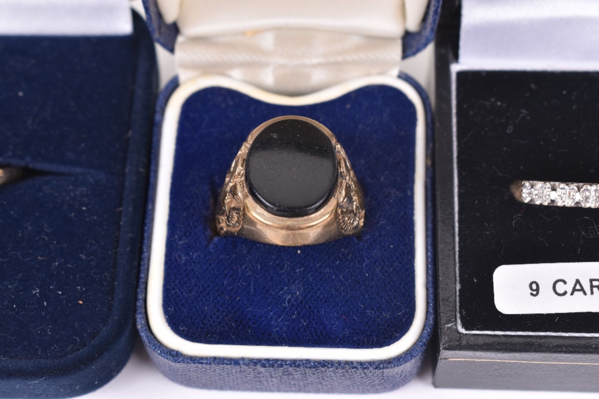 A 9ct gold mens signet ring with jet cabochon, with a 9ct gold solitaire diamond ring flanked by two - Image 4 of 5