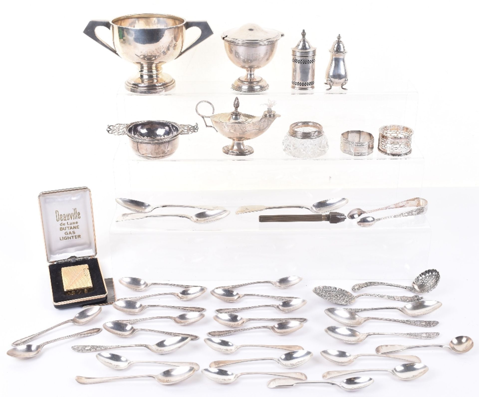 A mixed lot of silver items including a three Victorian dessert spoons, a set of ten tea spoons, She