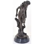 A mid 20th century bronze figure of a nude female, stood on trunk looking down, raised on turned bas