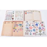 A collection of eight stamp albums and booklets, including British and world examples