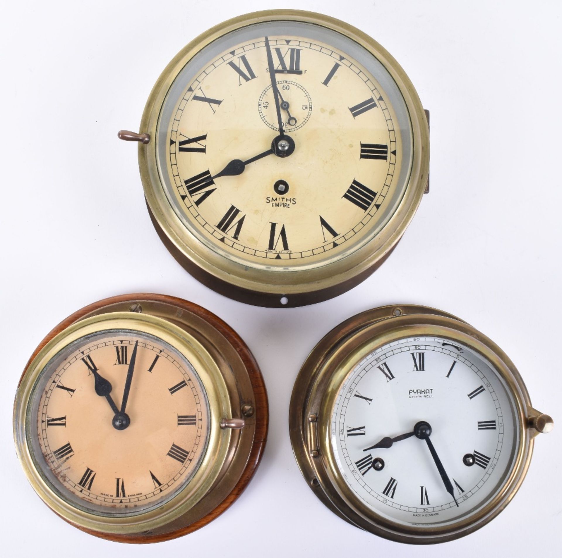 A mid 20th century brass cased ships clock by Smiths Empire, with key