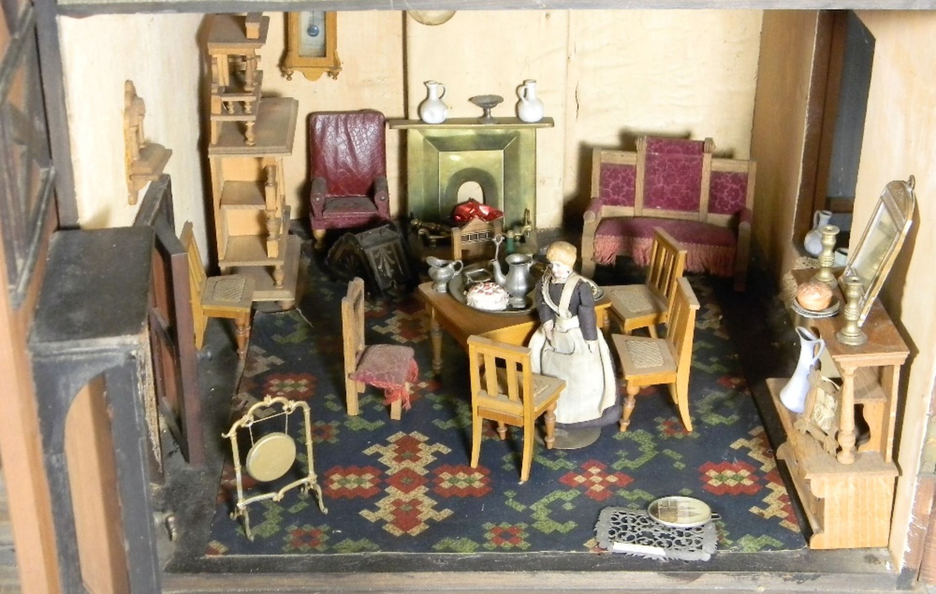 A large and impressive wooden dolls house and contents on stand, probably German circa 1880, - Image 10 of 13