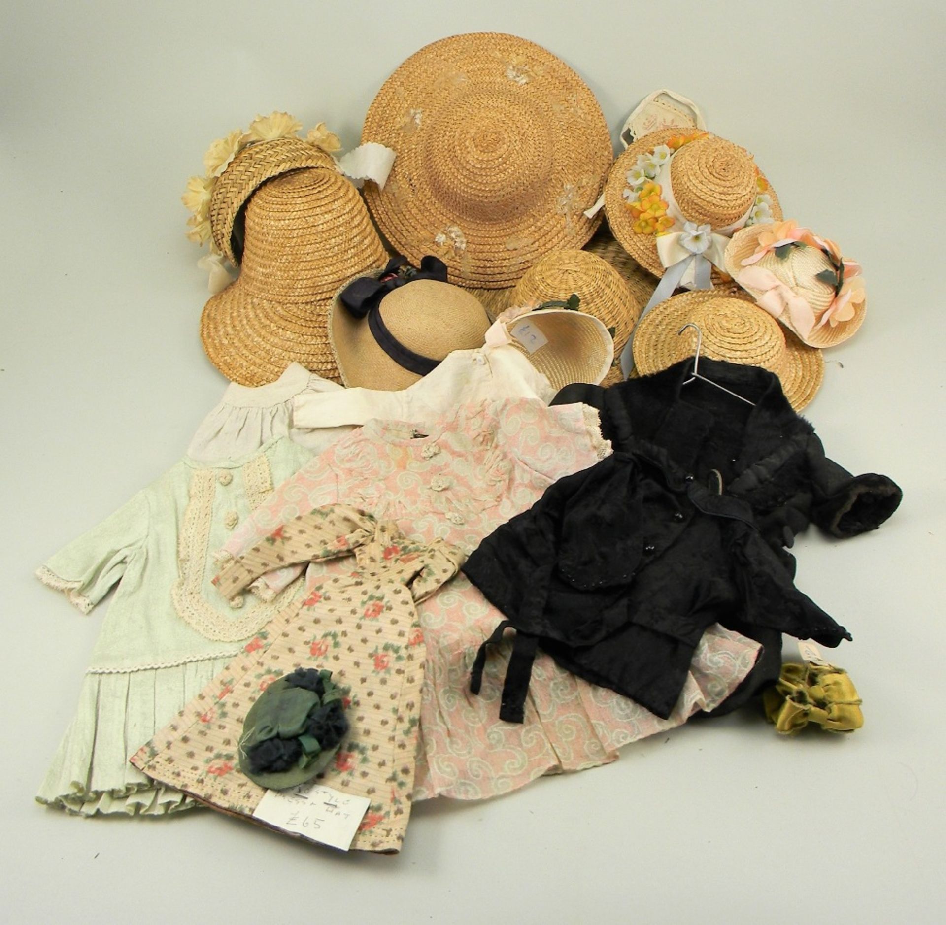 Collection of dolls clothes, straw bonnets, ribbons, lace and more,