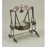 A Silver metal dolls house hanging cradle, continental 19th century,