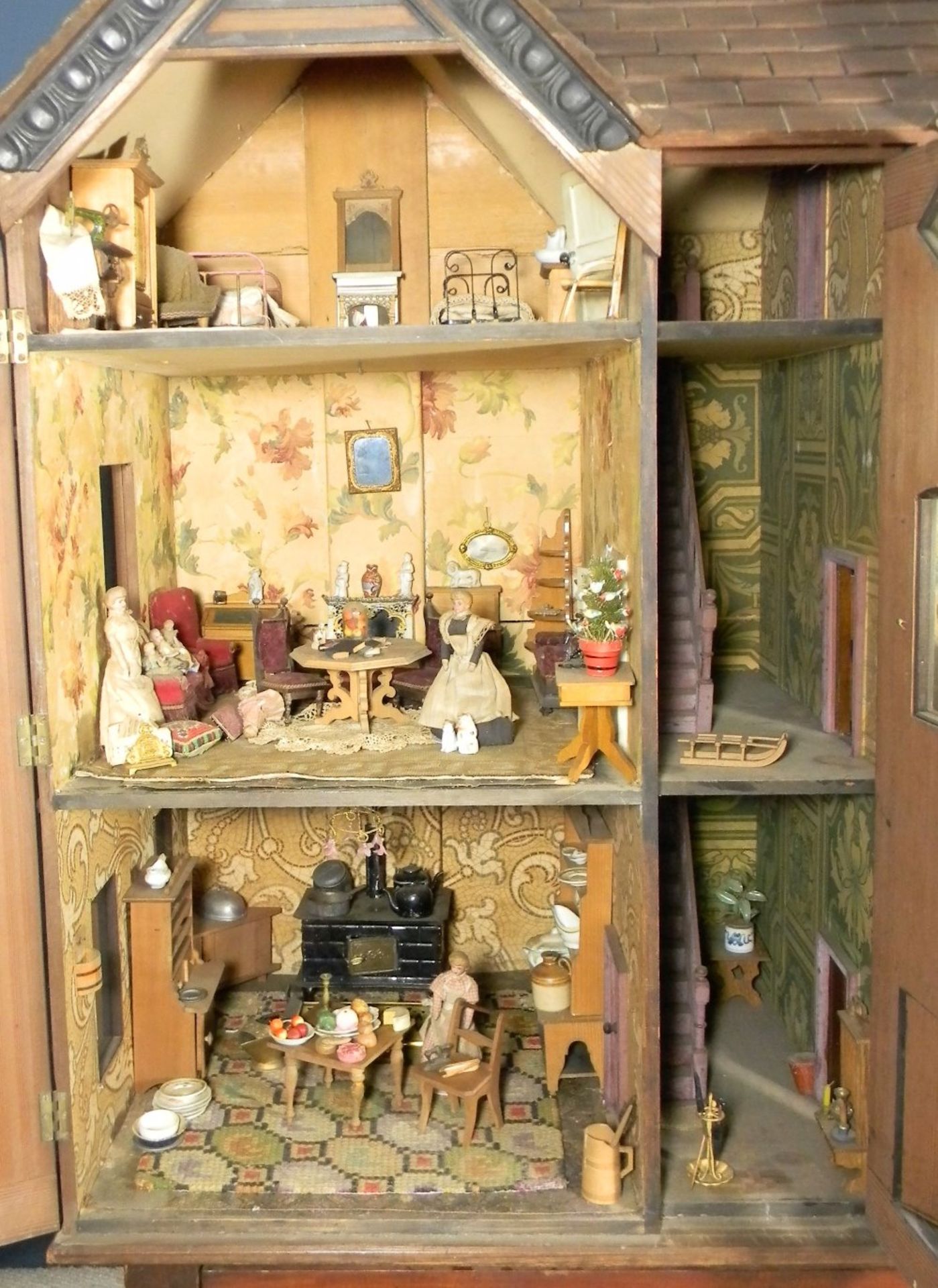 A large and impressive wooden dolls house and contents on stand, probably German circa 1880, - Image 6 of 13
