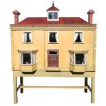 Large early English painted wooden dolls house on stand with contents, mid 19th century,