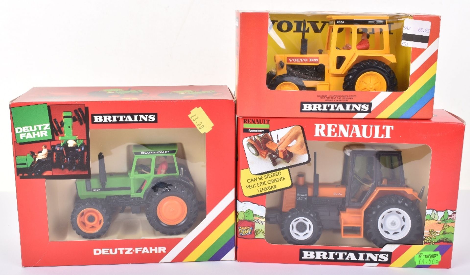 Three Boxed Britains Tractors
