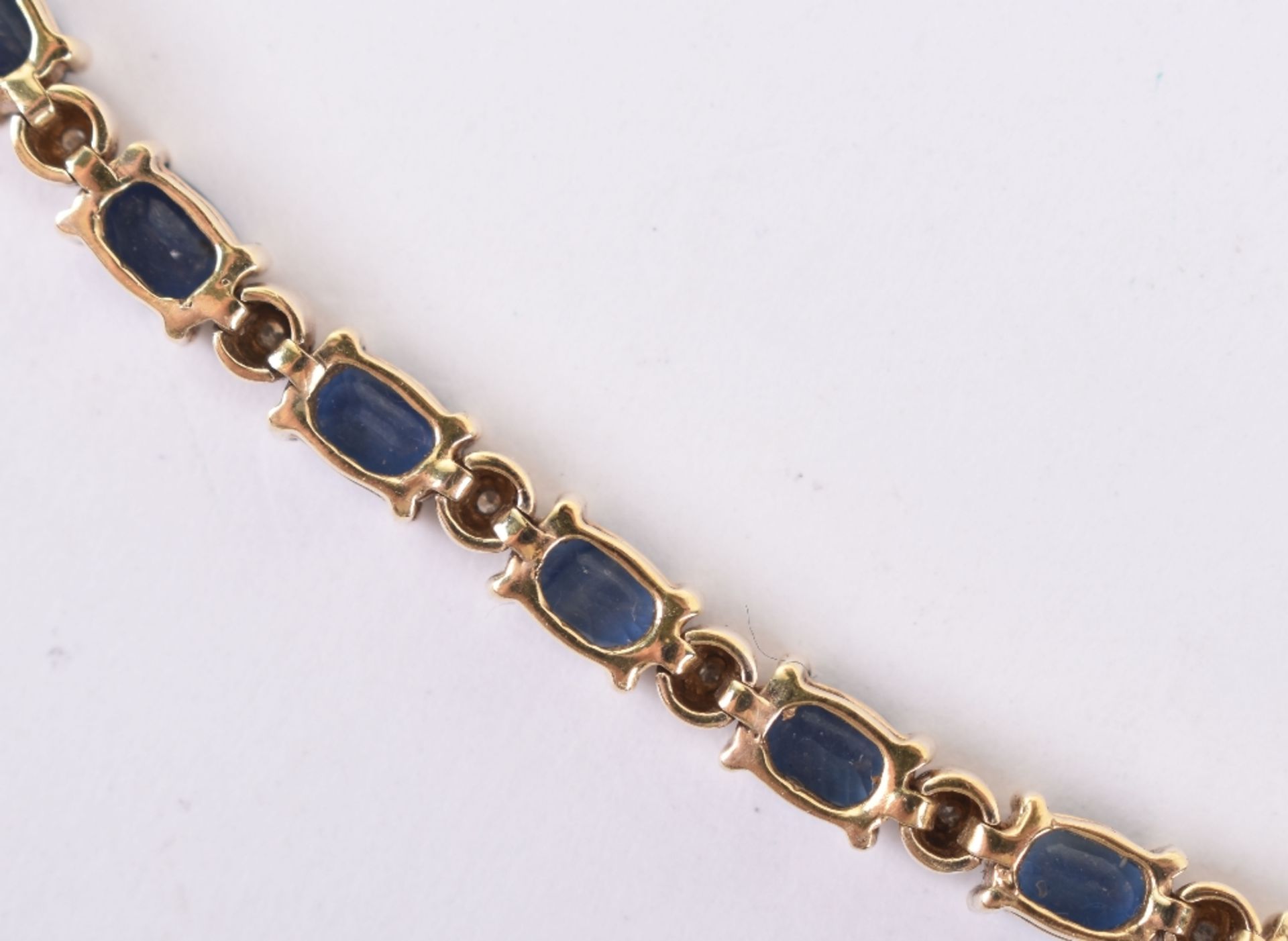 A sapphire and diamond eternity bracelet - Image 5 of 5
