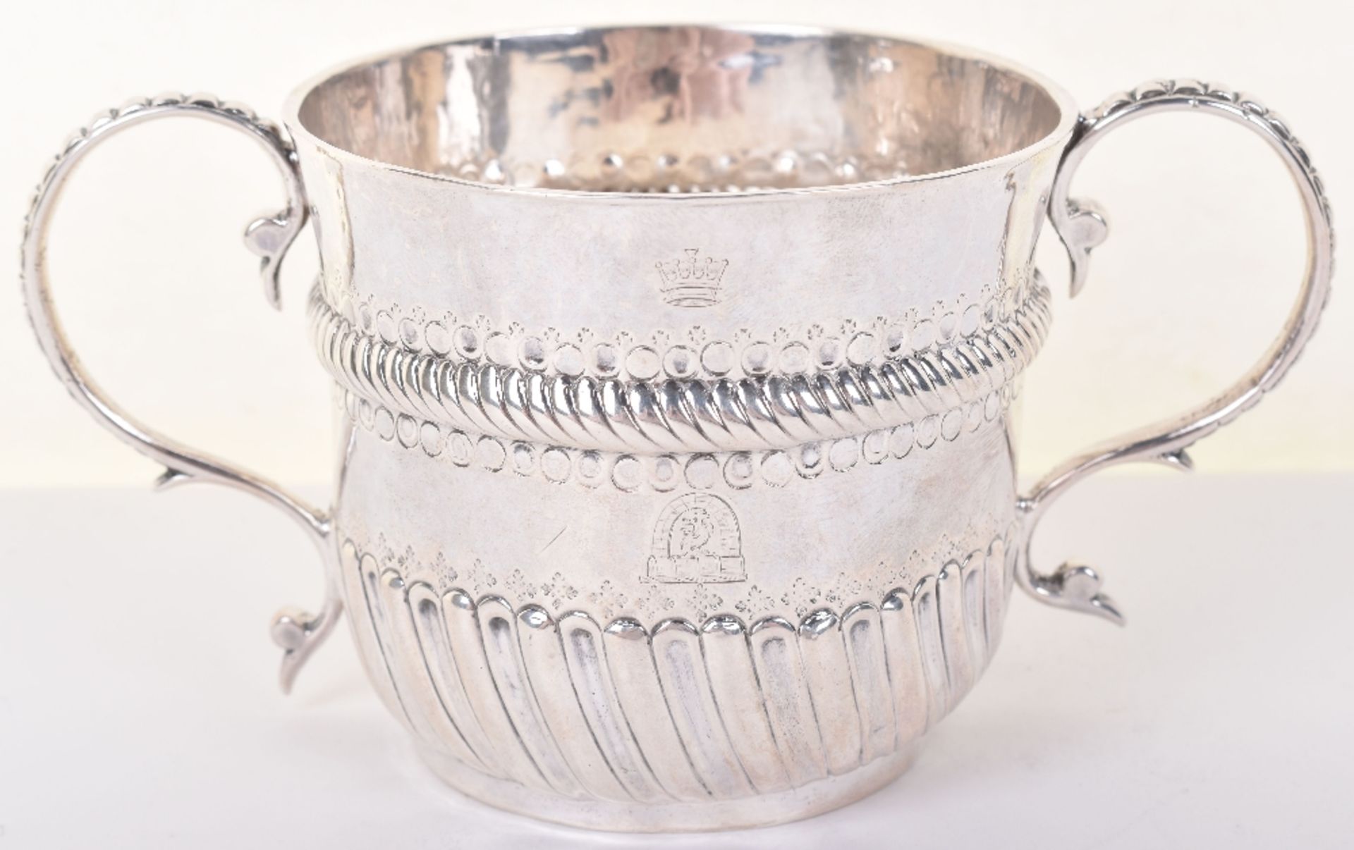 A Queen Anne silver porringer, John Gibbons, London 1701