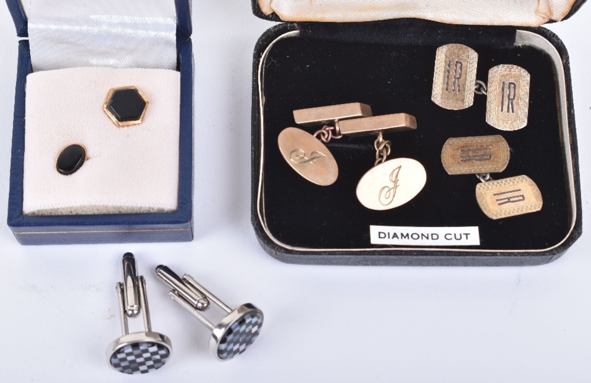 A pair of 9ct gold cufflinks with three others