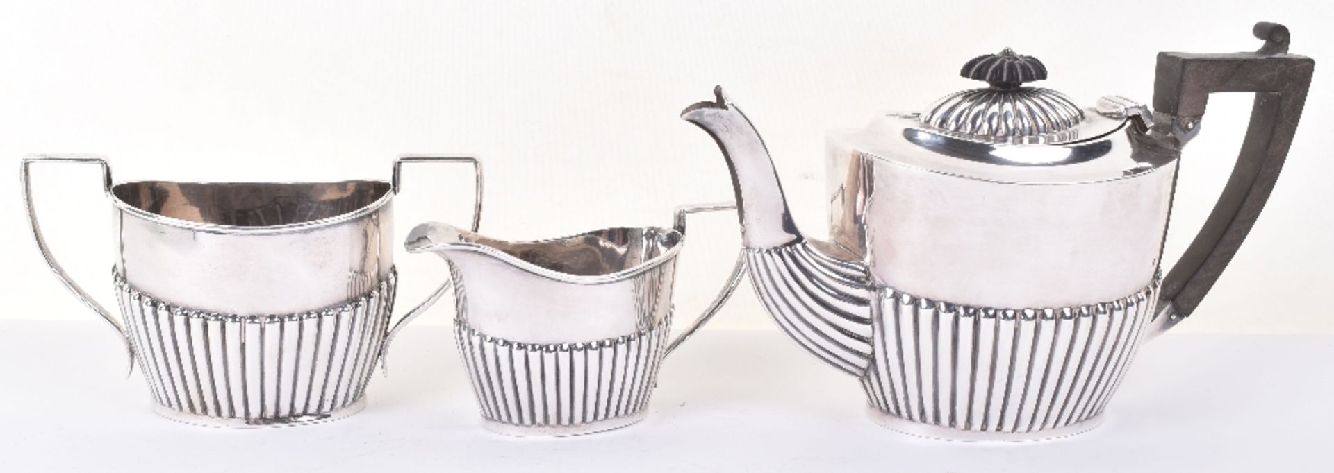 An early 20th century silver three piece tea set, William J. Holmes, Birmingham 1906