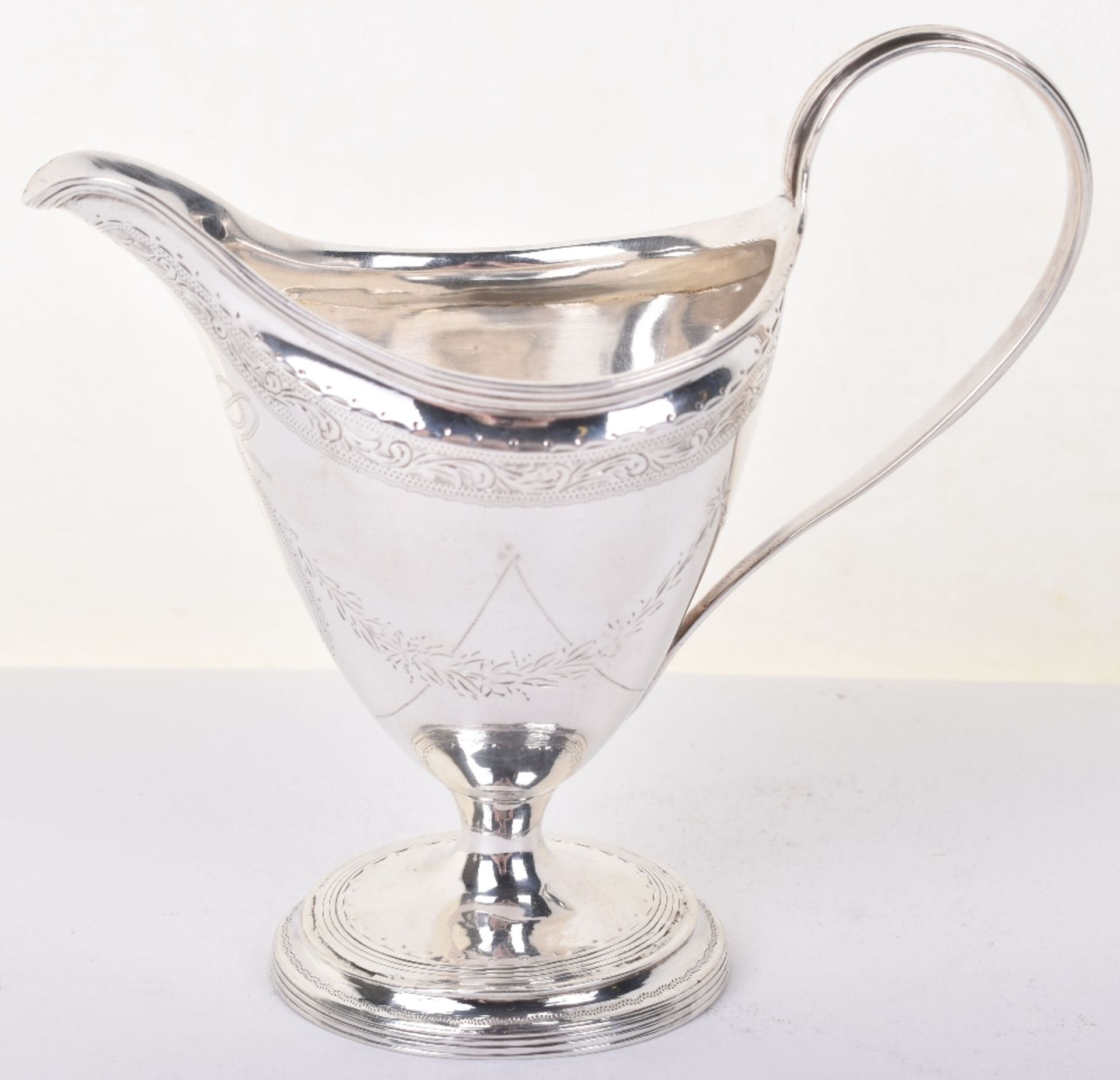 A George III silver cream jug, James Sutton, London 1793 - Image 2 of 8