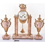 A late 19th century French rose marble clock garniture