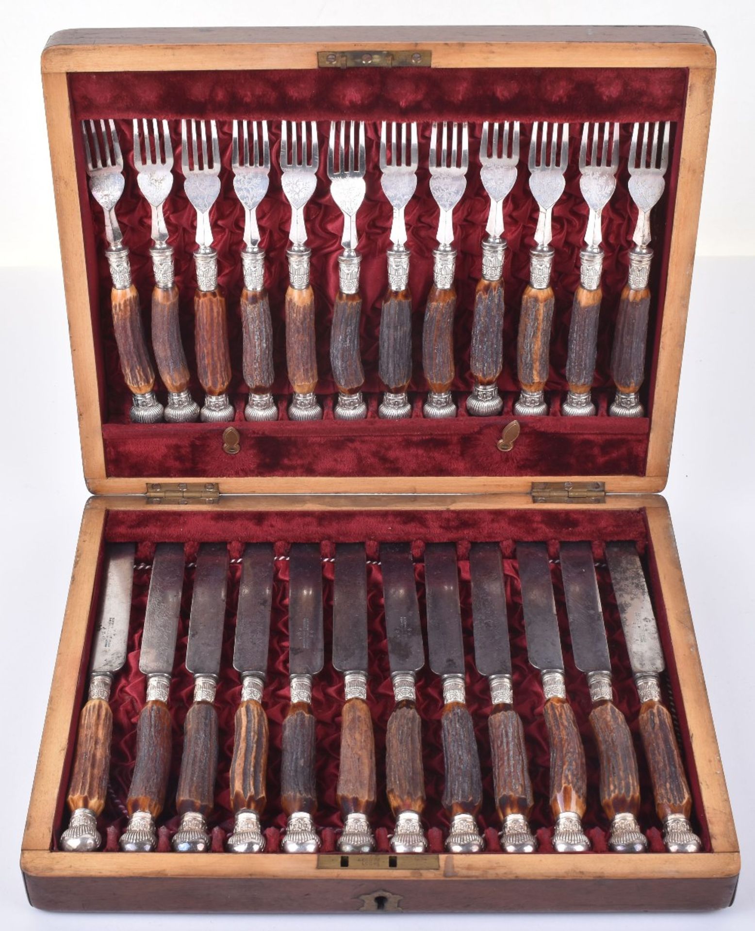 A cased set of twelve Victorian antler handle knives and forks, by Joseph Rogers & Sons