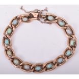 A 9ct gold and opal set chain link bracelet