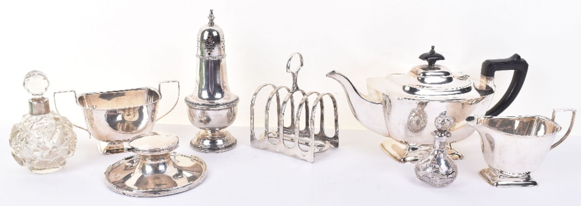 An early 20th century silver inkwell, a silver silver and glass scent bottle engraved Sterling Silve