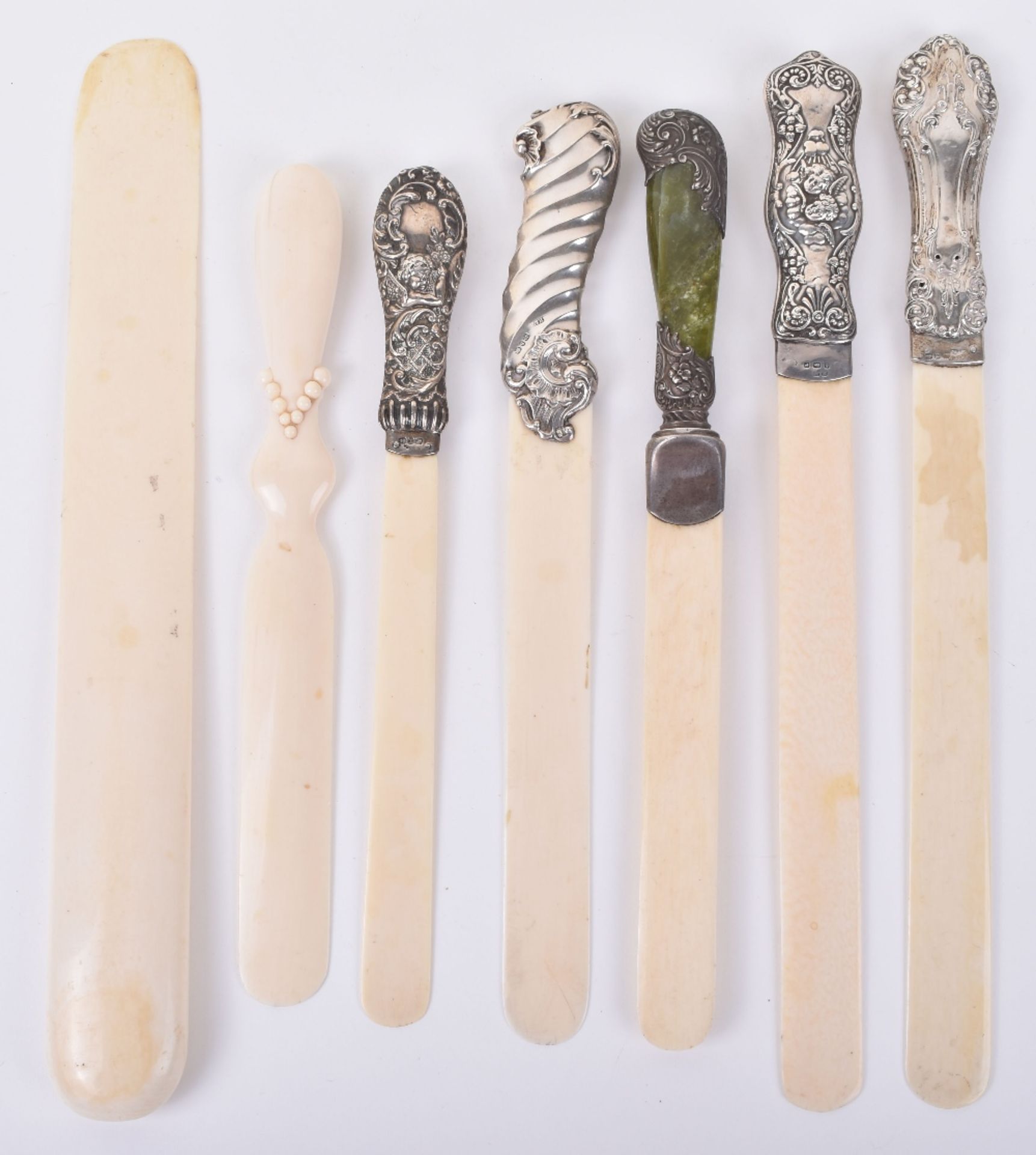 ^Four Victorian and Edwardian silver and ivory page turners