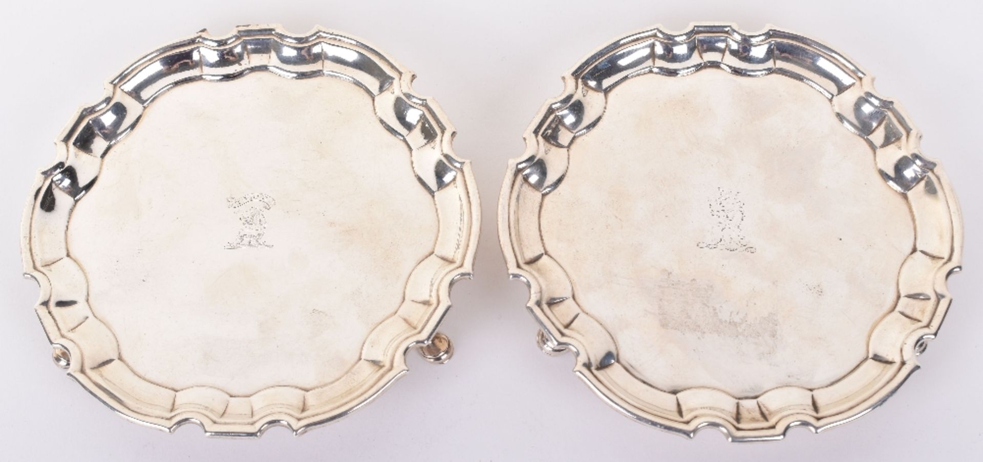 A matched pair of George III silver salvers, by John Tuite, London 1811 and 1813