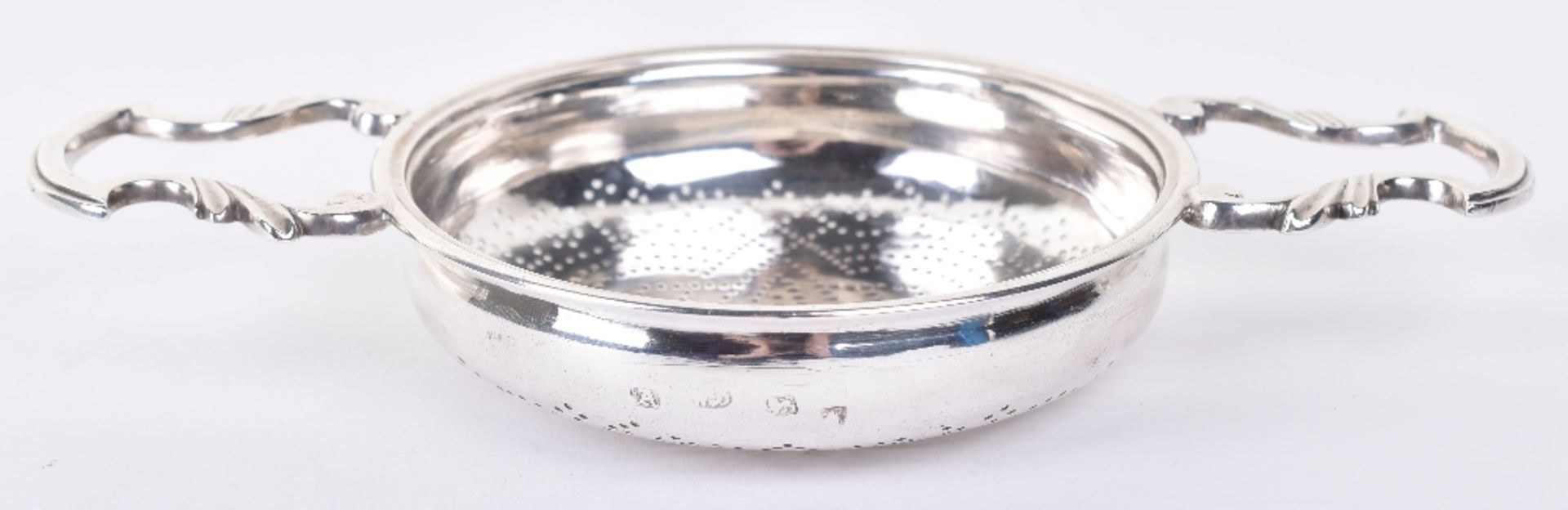 A George II silver lemon strainer, by William Bond, London 1756