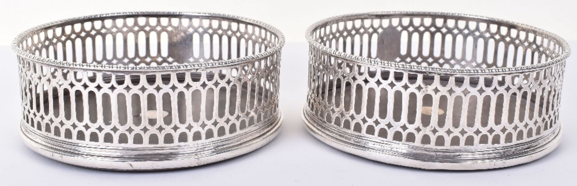 A pair of George III silver mounted coasters, by John Wittingham, London 1773 - Image 5 of 5