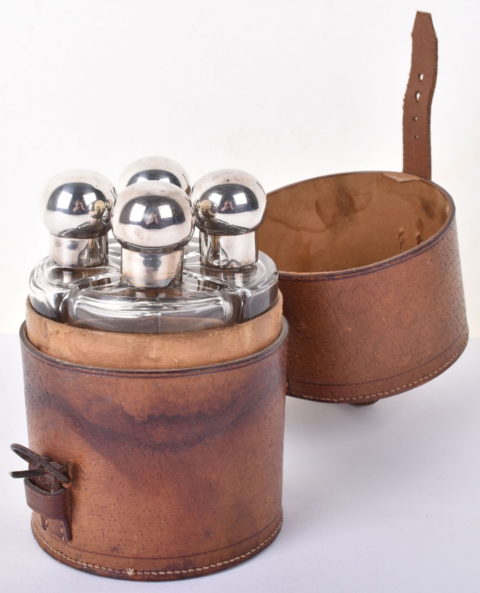 A set of four early 20th century silver mounted travel bottels, by Eugene Henry Posen, Birmingham 19