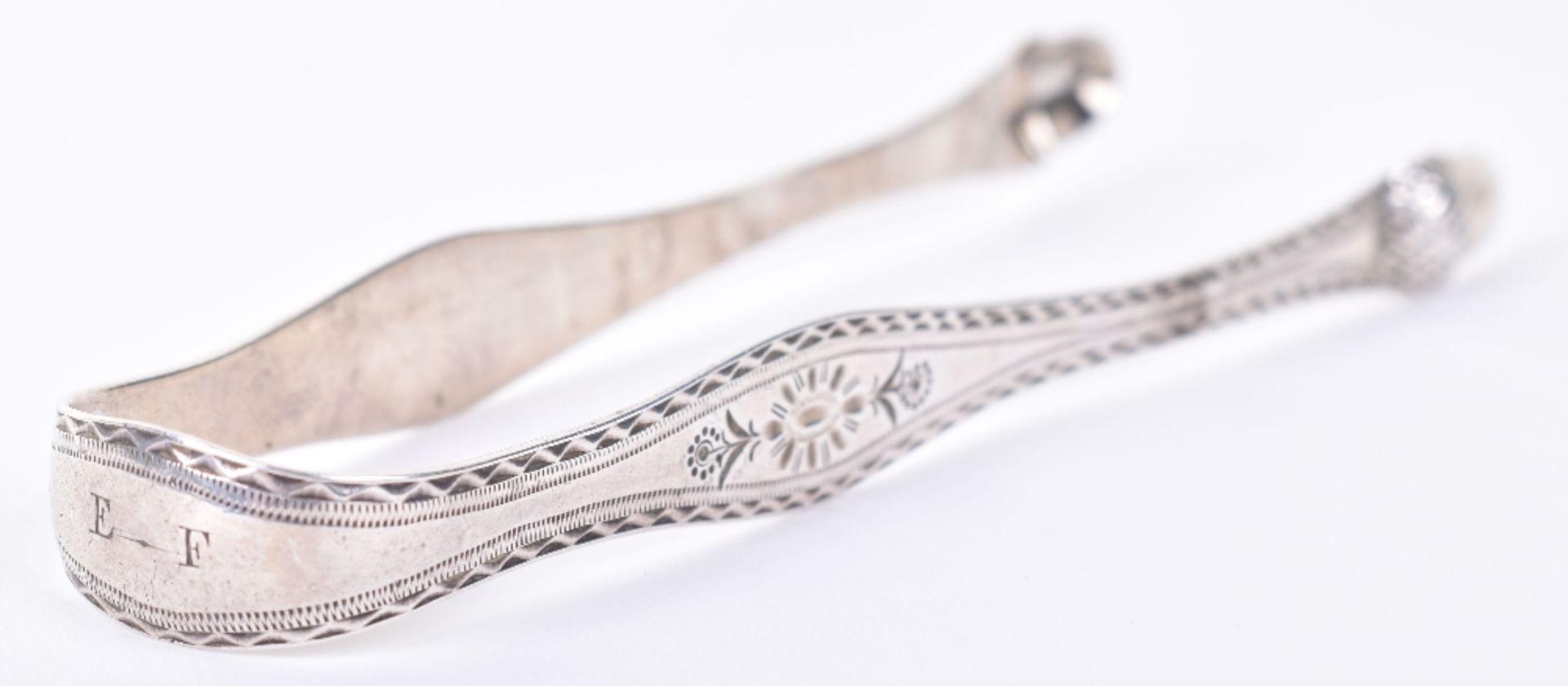 A pair of pretty silver acorn George III sugar tongs, by Samuel Godbehere & Edward Wigan