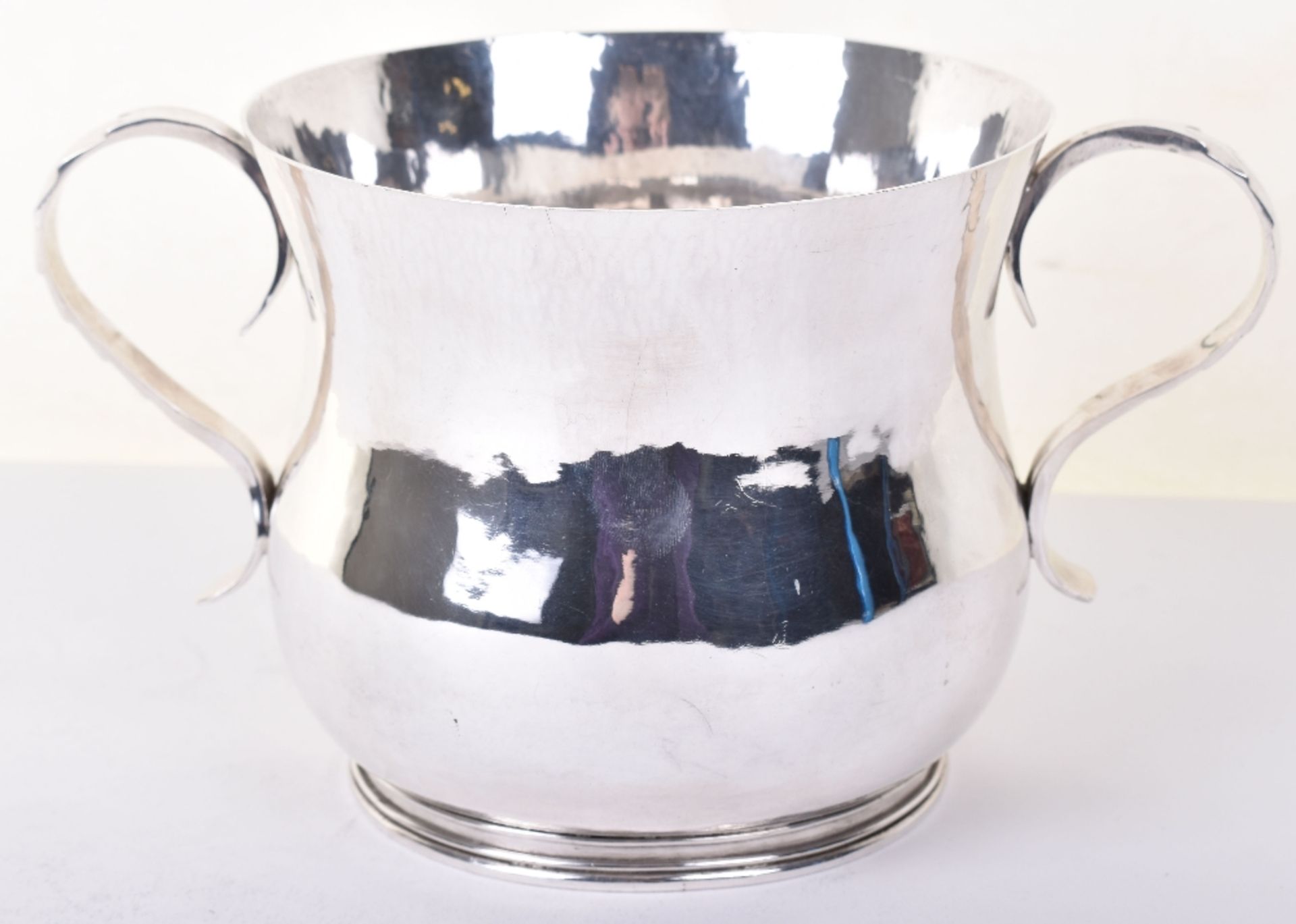 A mid 20th century hammered silver porringer, marked ANS, London 1951