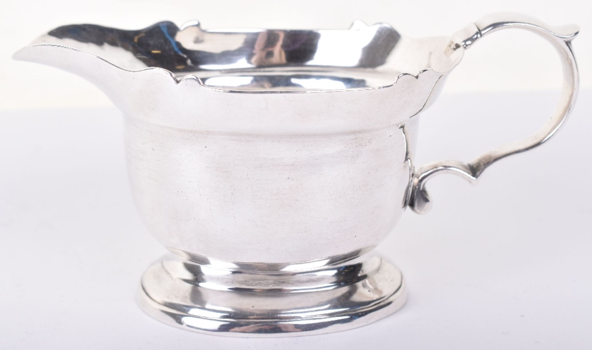 A George II silver gravy boat, by John Eckford II, London 1729