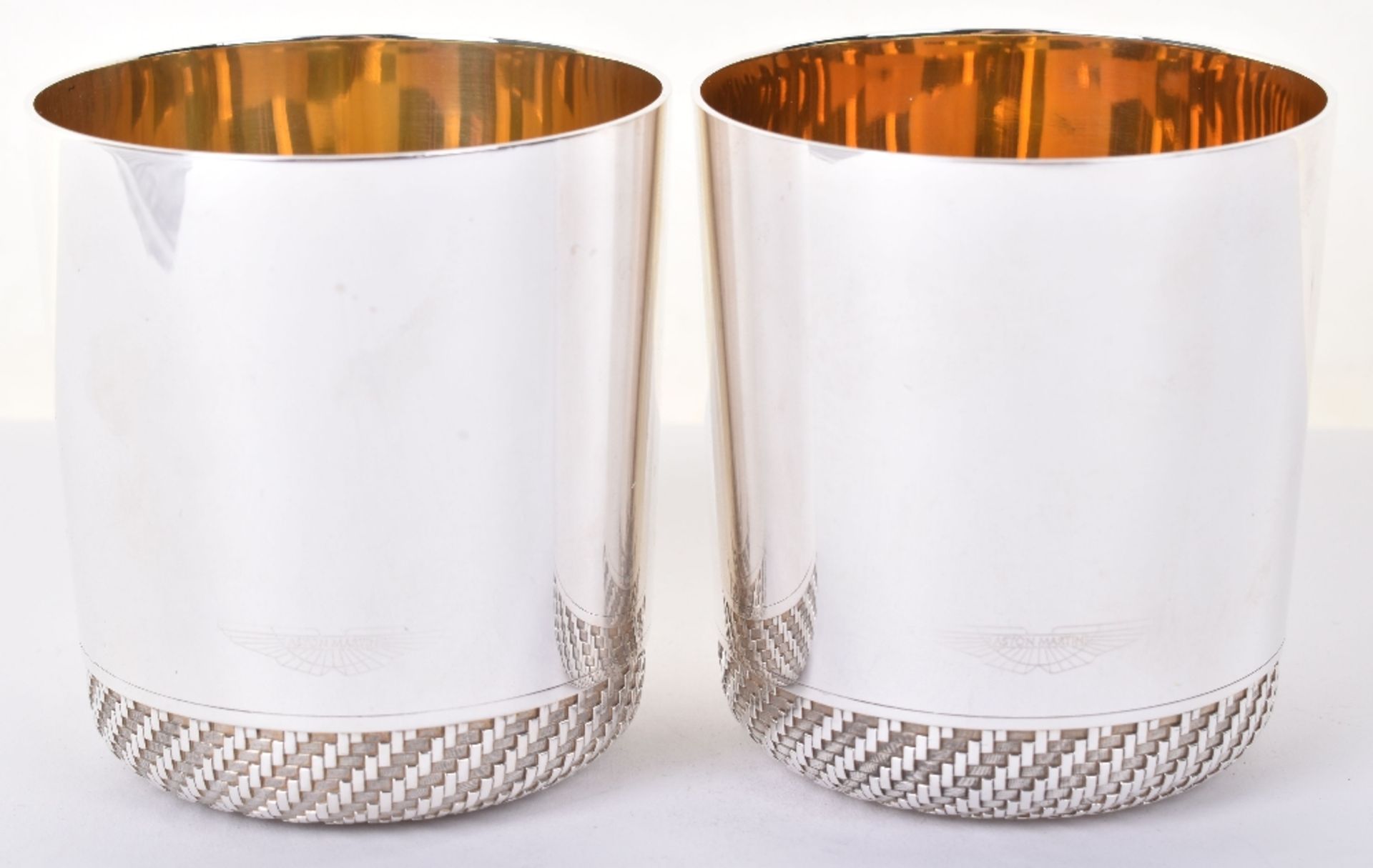 A pair of modern silver Aston Martin whiskey tumblers, by Grant Macdonald, London 2011