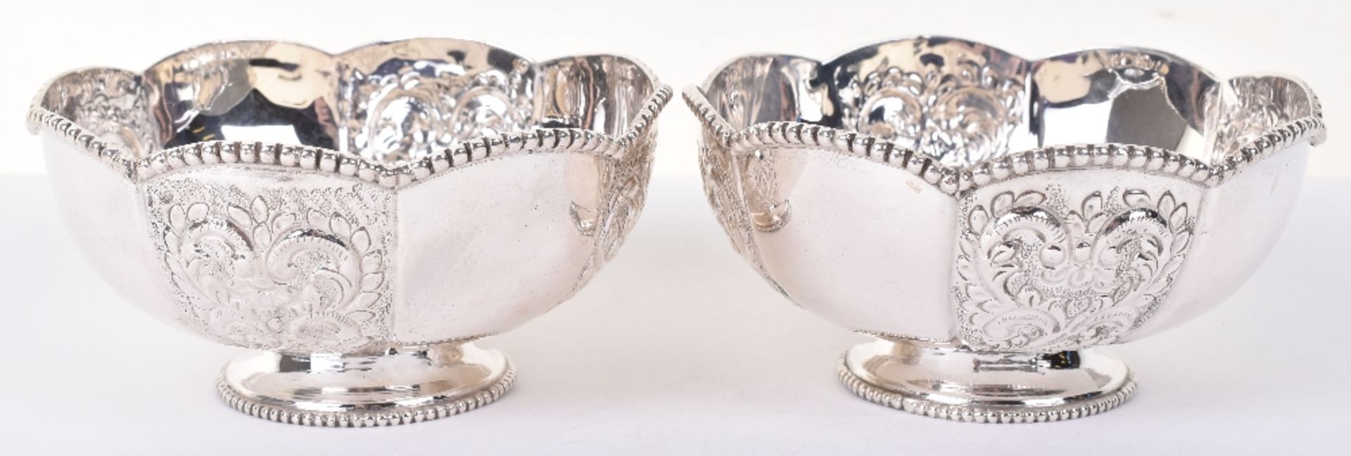 A pair of modern silver embossed bowls