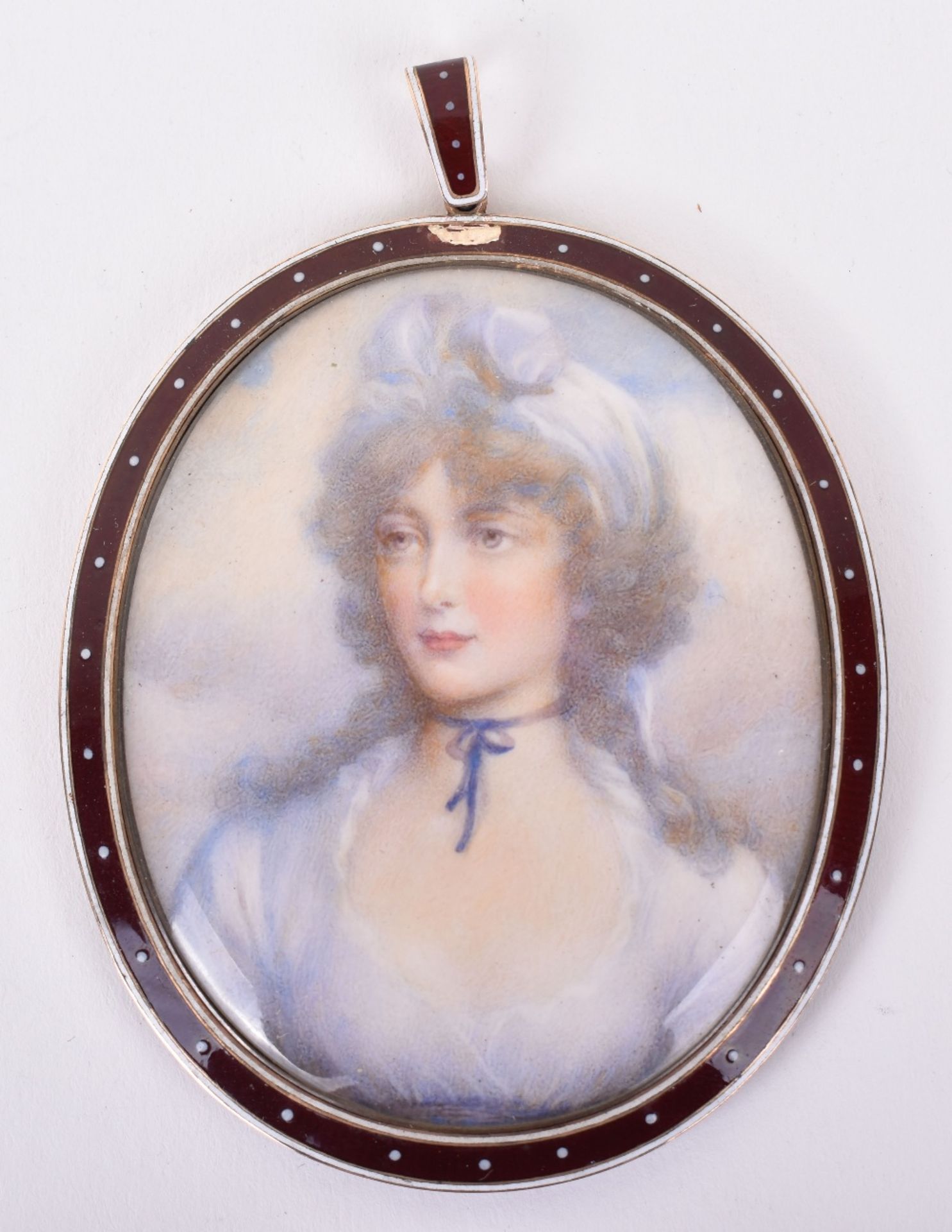 A Georgian gold (inmarked) and enamel mounted portrait miniature